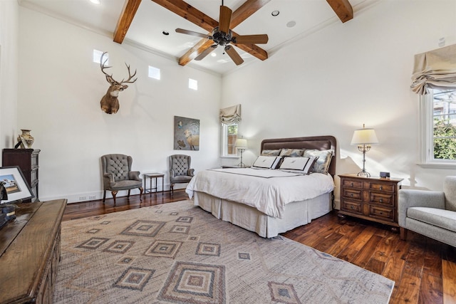 bedroom with dark wood-style floors, baseboards, coffered ceiling, and beam ceiling