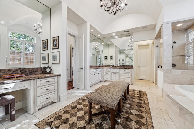 bathroom with a chandelier, recessed lighting, vanity, a bath, and a stall shower