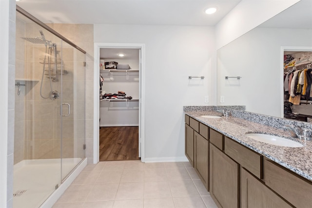 2533 Allegretto Sea Dr, Katy, TX 77493 - full bathroom featuring tile patterned flooring, a walk in closet, and a sink