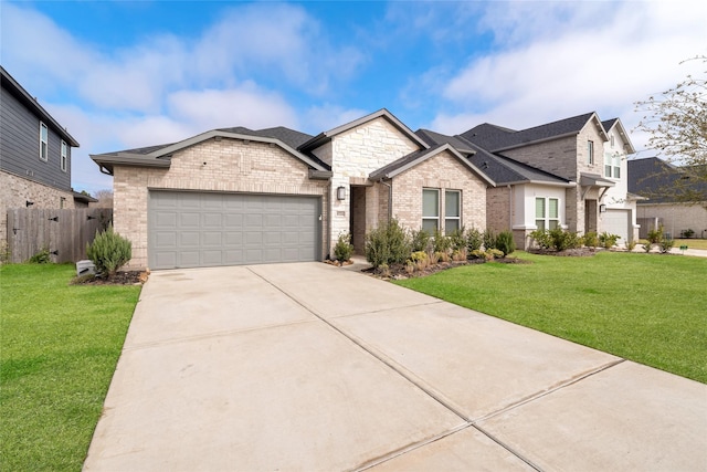 view of front facade with a front lawn, brick siding, driveway, and an attached garage