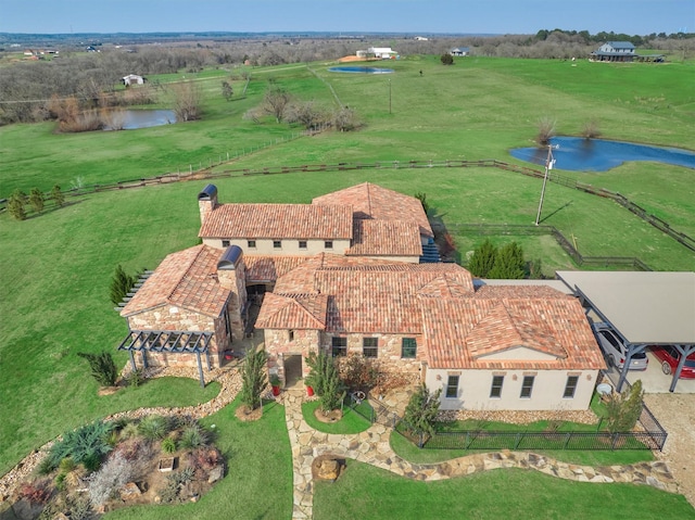 drone / aerial view featuring a rural view and a water view