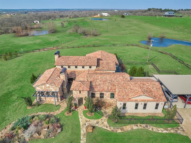 aerial view with a water view and a rural view
