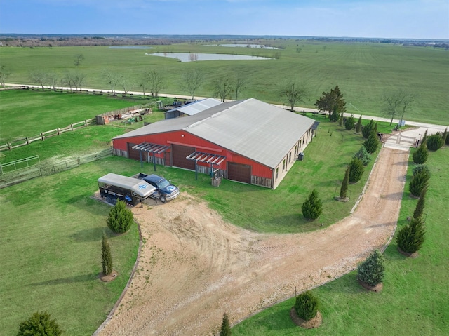 drone / aerial view featuring a rural view and a water view