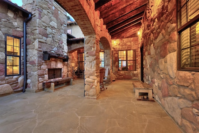 view of patio / terrace with an outdoor stone fireplace