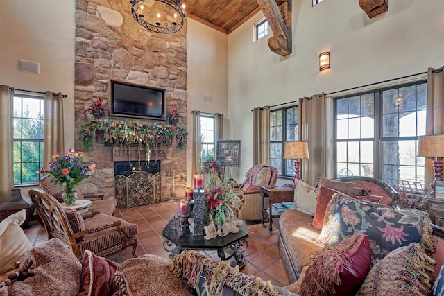 living room with plenty of natural light, tile patterned flooring, and a fireplace