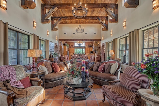 tiled living room featuring wooden ceiling, an inviting chandelier, a towering ceiling, and beamed ceiling