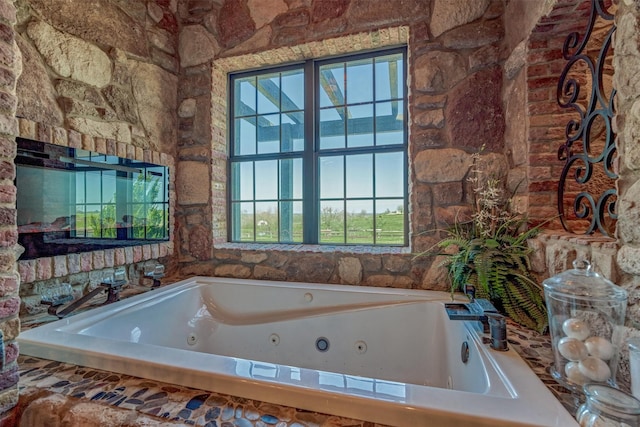 full bathroom featuring a jetted tub