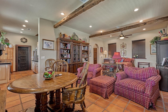 dining space with ceiling fan, arched walkways, beamed ceiling, and recessed lighting