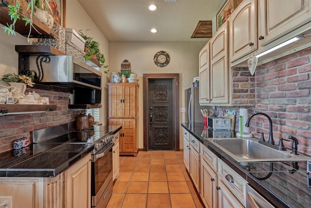 kitchen featuring light tile patterned flooring, recessed lighting, stainless steel appliances, a sink, and decorative backsplash