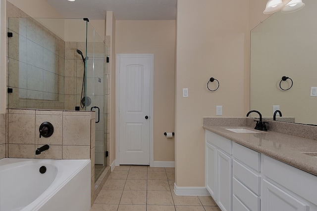 full bathroom featuring a garden tub, tile patterned flooring, vanity, baseboards, and a shower stall