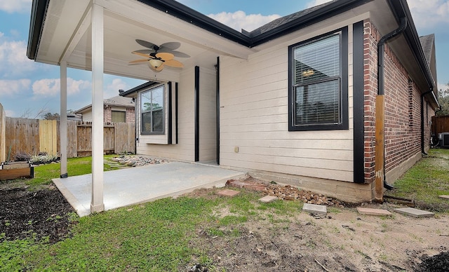 view of patio / terrace featuring ceiling fan, fence, and central AC