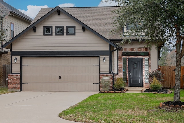 view of front facade with a garage, driveway, fence, and brick siding