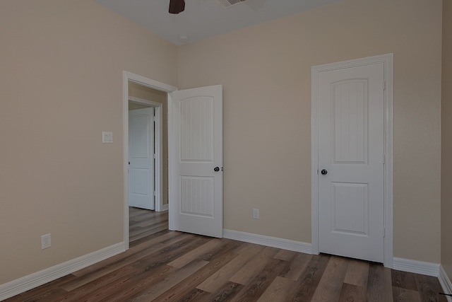 interior space featuring visible vents, baseboards, and wood finished floors