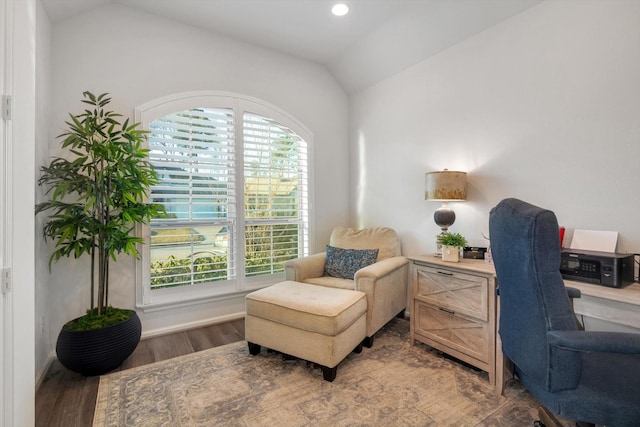 sitting room with lofted ceiling and wood finished floors