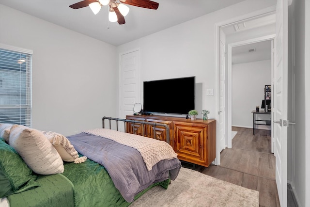 bedroom featuring ceiling fan and wood finished floors