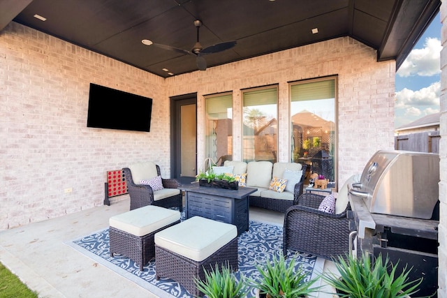 view of patio featuring a ceiling fan and outdoor lounge area