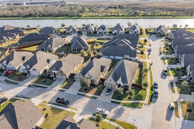 bird's eye view with a residential view and a water view