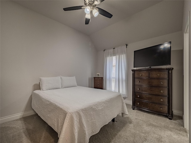 bedroom featuring a ceiling fan, lofted ceiling, light colored carpet, and baseboards