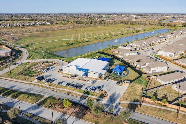 bird's eye view with a residential view and a water view