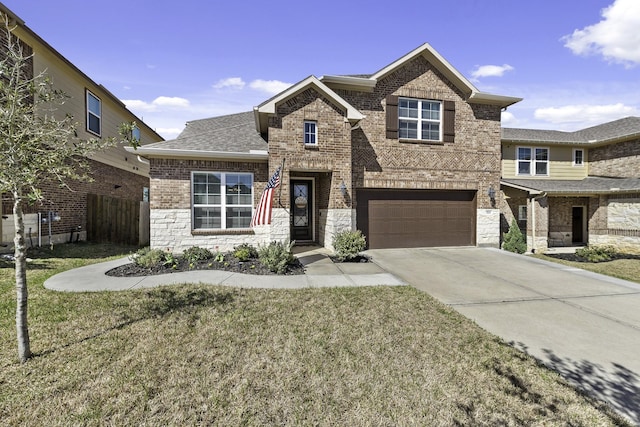 view of front facade with an attached garage, driveway, brick siding, and a front yard