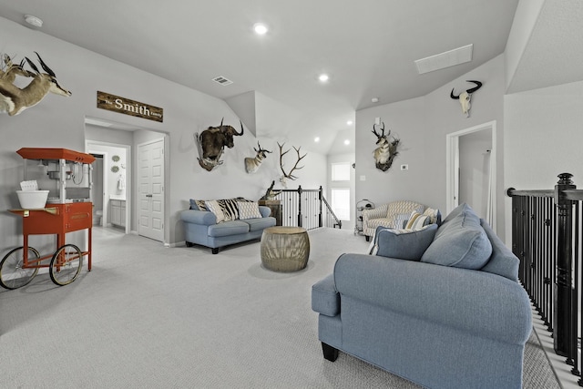 living room featuring recessed lighting, visible vents, and light carpet