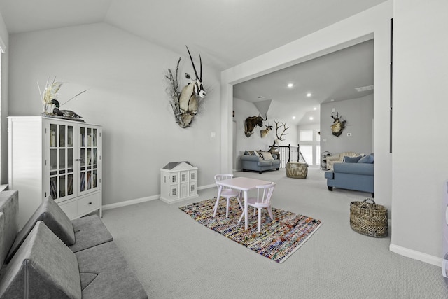 interior space with lofted ceiling, light carpet, baseboards, and recessed lighting