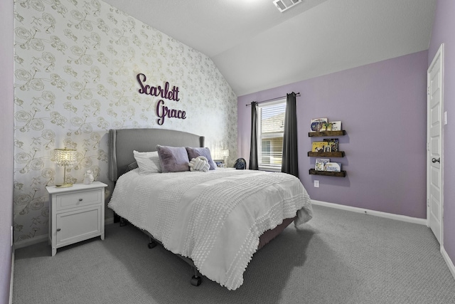 bedroom with light carpet, wallpapered walls, vaulted ceiling, and baseboards