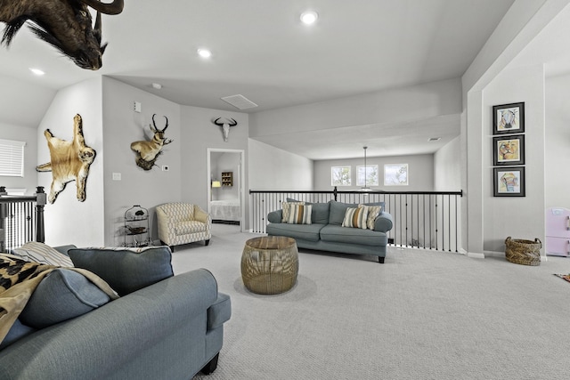 carpeted living area featuring recessed lighting