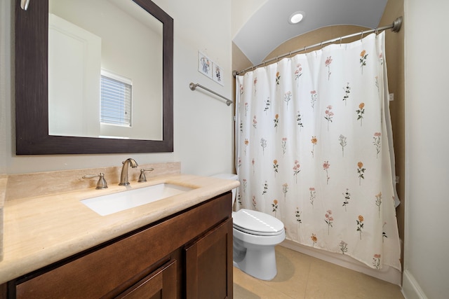 bathroom with toilet, curtained shower, tile patterned flooring, and vanity