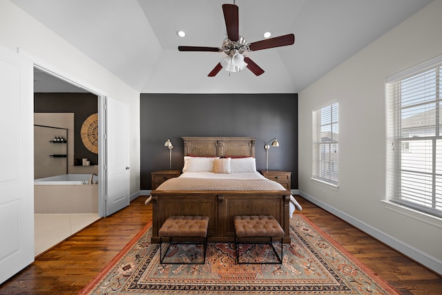 bedroom with dark wood-type flooring, lofted ceiling, multiple windows, and baseboards