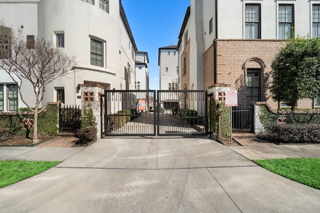 view of gate featuring fence