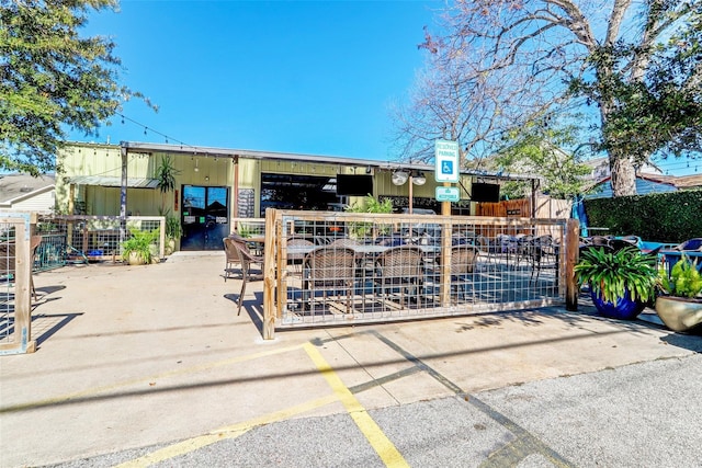 view of community with fence