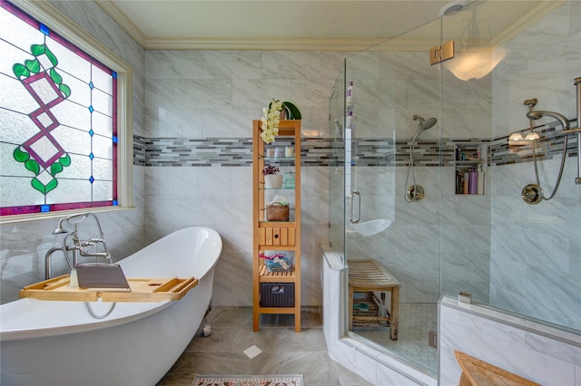 full bath featuring a shower stall, a freestanding bath, tile walls, and crown molding