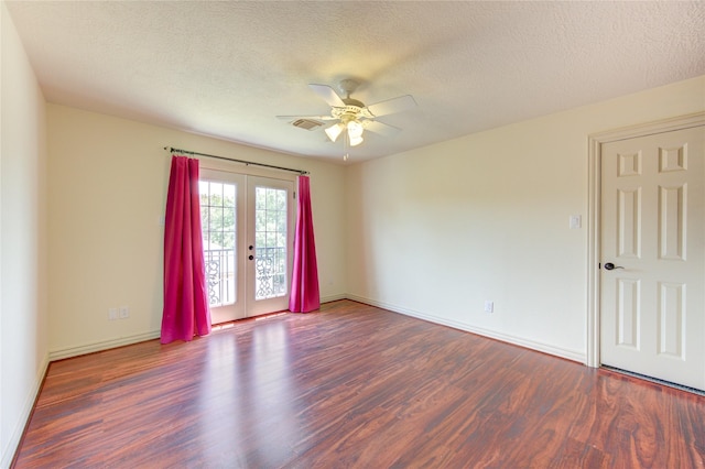 unfurnished room featuring a textured ceiling, wood finished floors, visible vents, a ceiling fan, and french doors