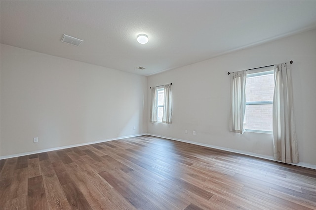 9514 Barr Spring Dr, Humble, TX 77396 - unfurnished room featuring wood finished floors and baseboards