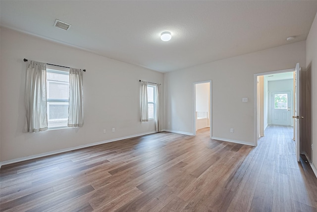 9514 Barr Spring Dr, Humble, TX 77396 - spare room featuring wood finished floors and a smoke detector