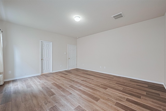 9514 Barr Spring Dr, Humble, TX 77396 - spare room with light wood-style flooring and baseboards
