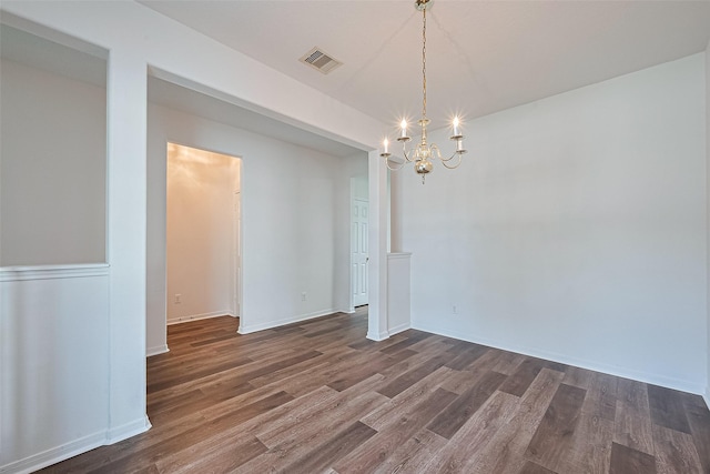 9514 Barr Spring Dr, Humble, TX 77396 - unfurnished room featuring a chandelier and wood finished floors