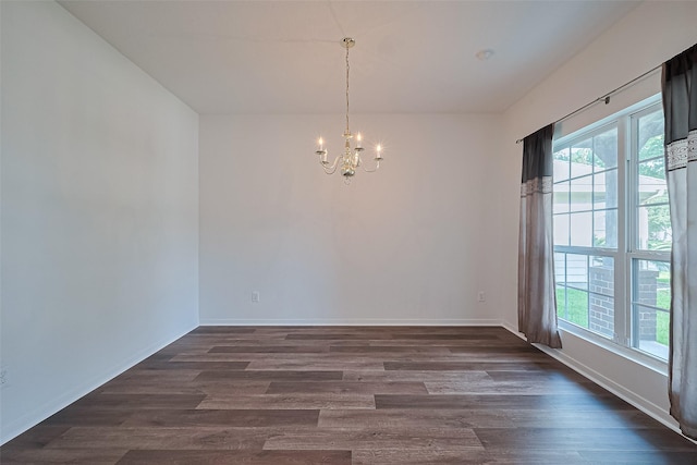 9514 Barr Spring Dr, Humble, TX 77396 - empty room with a chandelier and dark wood-style flooring
