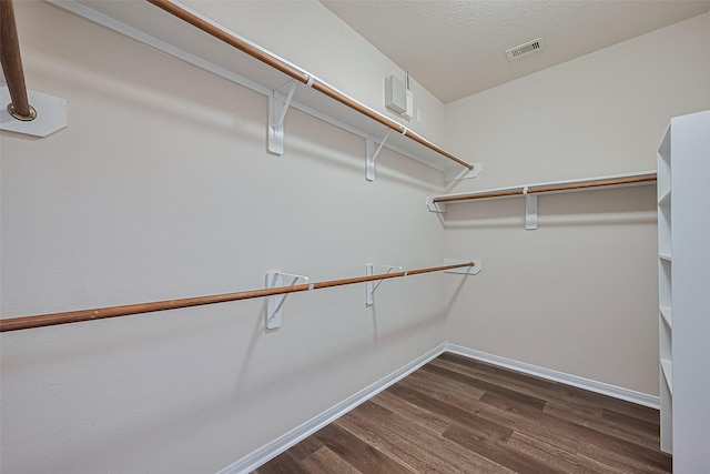 9514 Barr Spring Dr, Humble, TX 77396 - spacious closet featuring dark wood-style flooring