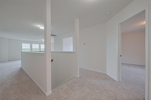 9514 Barr Spring Dr, Humble, TX 77396 - hallway with carpet flooring and an upstairs landing
