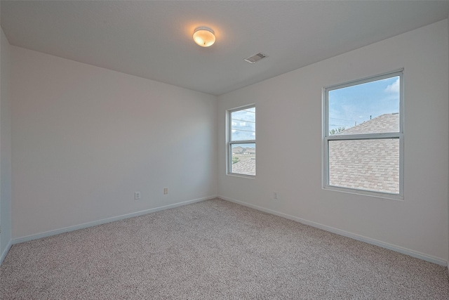 9514 Barr Spring Dr, Humble, TX 77396 - empty room with plenty of natural light and carpet flooring