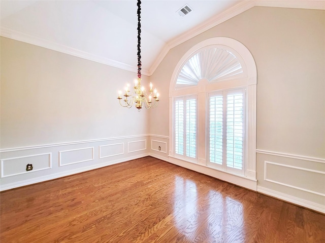 interior space with visible vents, wainscoting, an inviting chandelier, and lofted ceiling