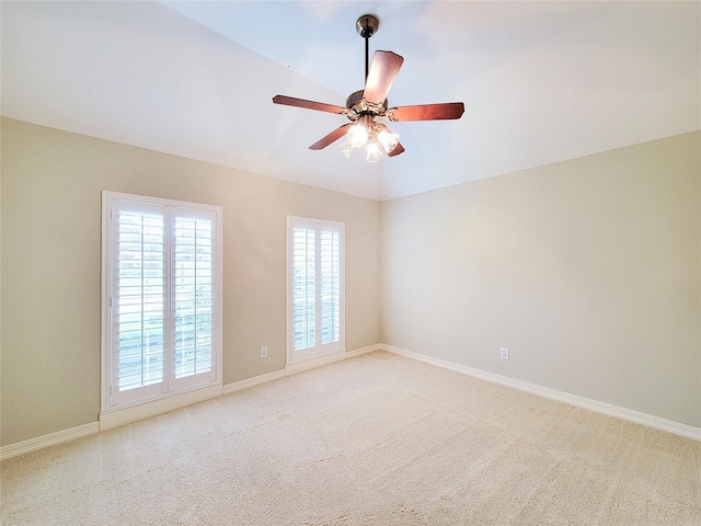 spare room with light colored carpet and plenty of natural light