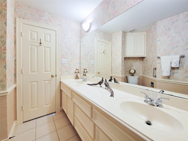 full bathroom with tile patterned flooring, a sink, toilet, and wallpapered walls