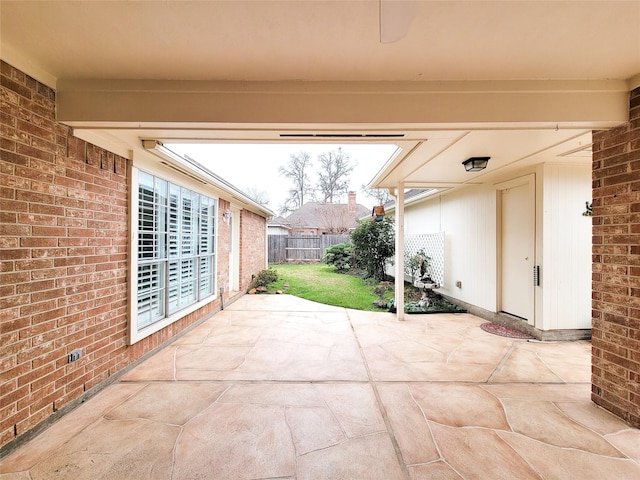 view of patio featuring fence