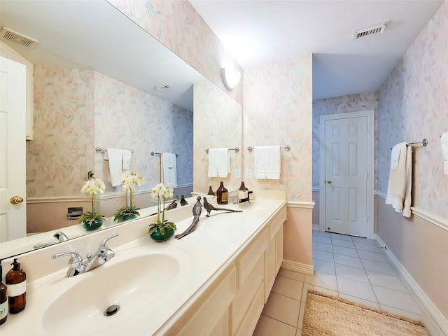 full bathroom featuring visible vents, a sink, tile patterned floors, and double vanity