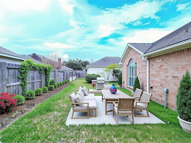 view of yard featuring an outdoor living space, a fenced backyard, and a patio area