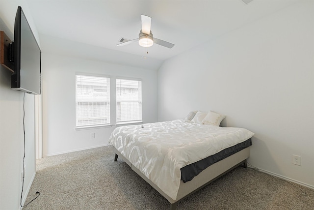 bedroom featuring lofted ceiling, ceiling fan, carpet, and baseboards