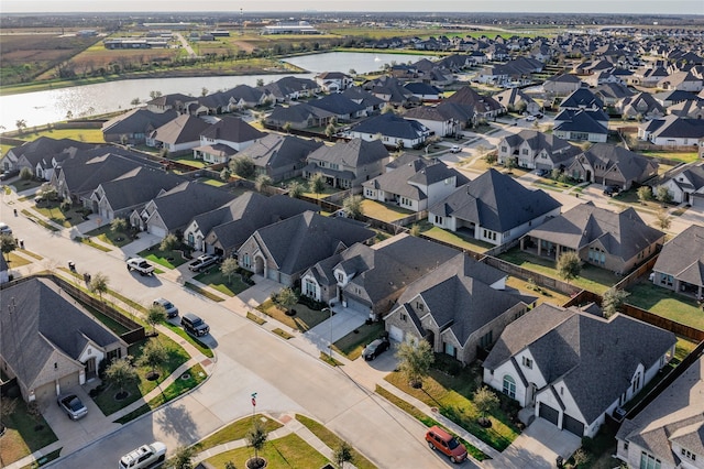 aerial view featuring a water view and a residential view